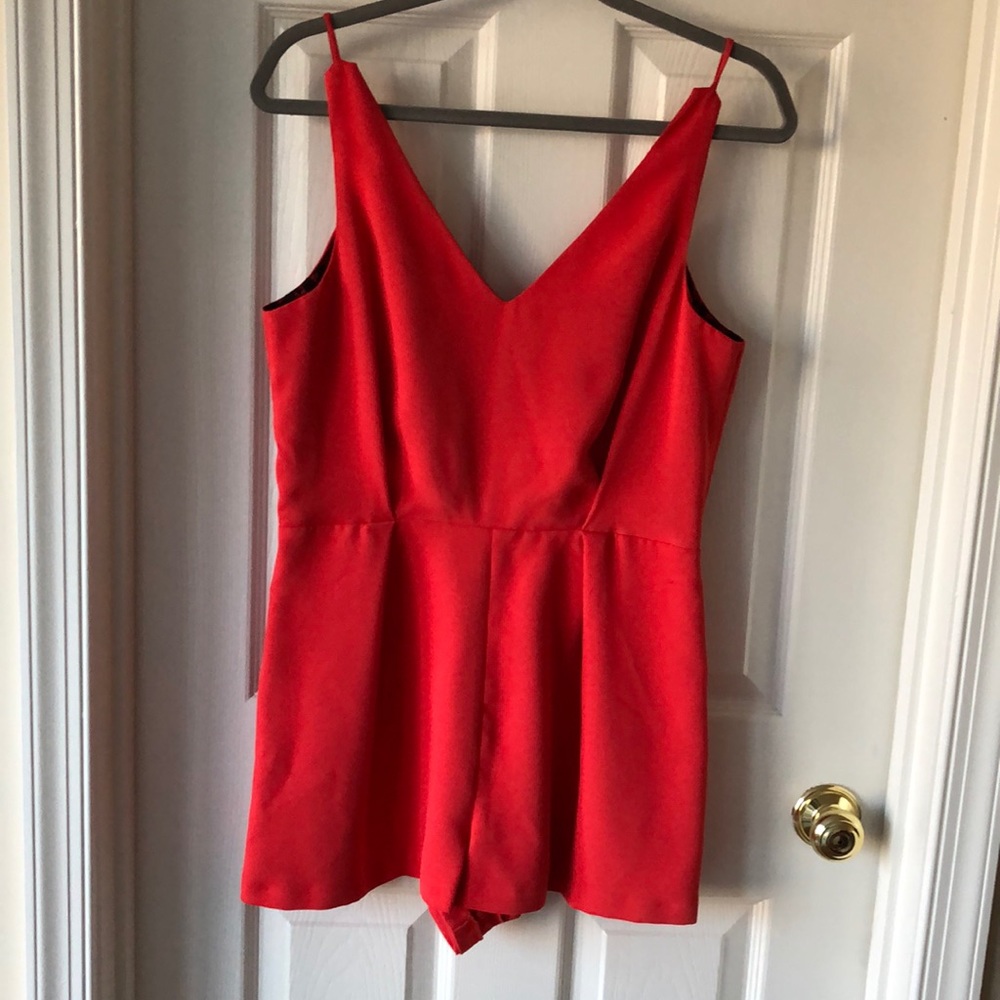Red romper with black lace detail in back